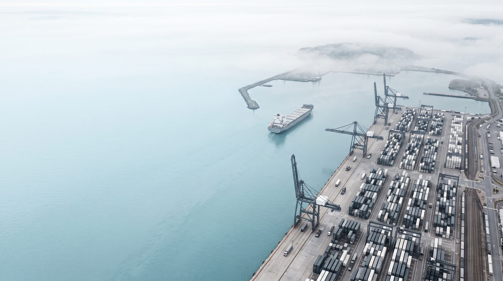 Aerial view of an unbranded port in morning fog